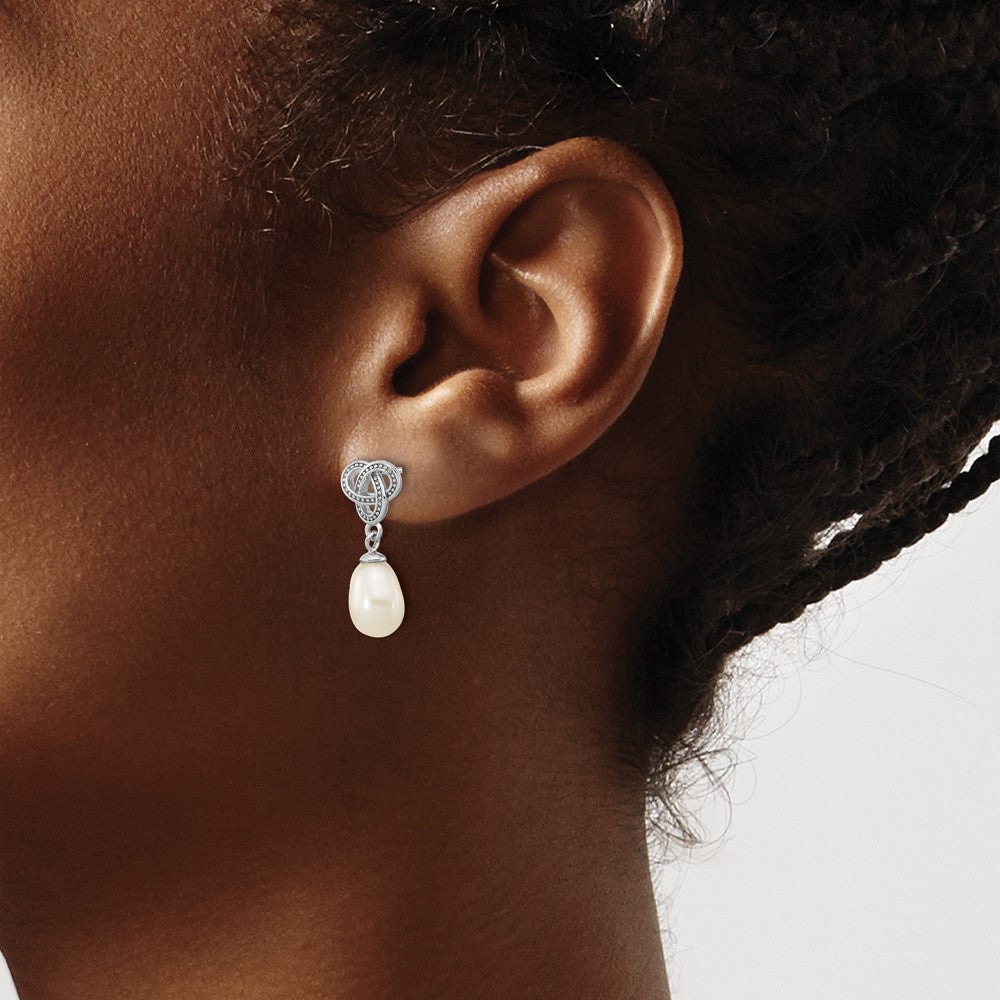 QE16351 Sterling Silver Rhodium-plated 6-7mm White Rice Freshwater Cultured Pearl Knot Post Dangle Earrings
